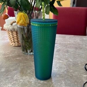 Green and blue venti Starbucks tumbler